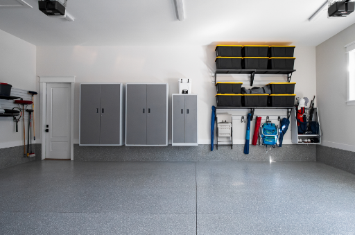 A clean, organized garage featuring sleek storage cabinets and shelving. Perfect for adding a garage heating system to keep the space comfortable year-round.