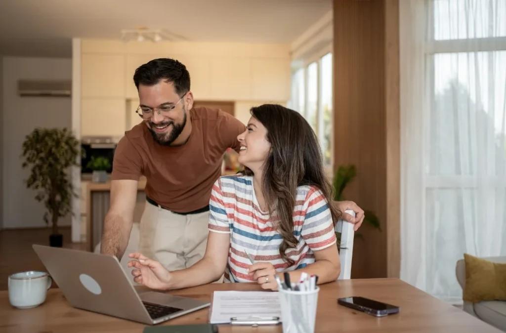 Man and Woman in living room, comfortable with their air conditioning running in Highland Park